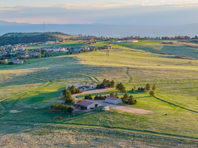 aerial view of property and surrounding area with rural landscape and mountains