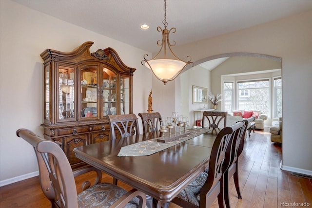 15857 E Aberdeen Ave, Centennial, CO 80016 - dining room with arched walkways, baseboards, recessed lighting, and wood finished floors