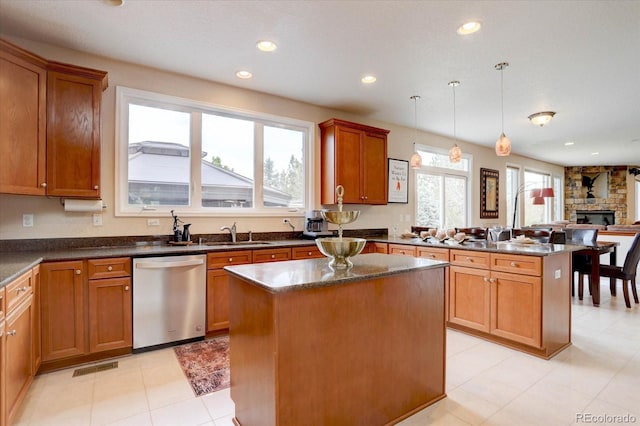 15857 E Aberdeen Ave, Centennial, CO 80016 - kitchen with stainless steel dishwasher, a center island, a peninsula, recessed lighting, and a sink