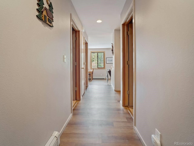 10000 Ryan Gulch Rd Unit 114, Silverthorne, CO 80498 - hall with wood finished floors, baseboards, and recessed lighting