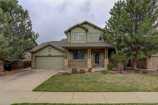 craftsman inspired home featuring fence, a front lawn, a garage, a porch, and concrete driveway