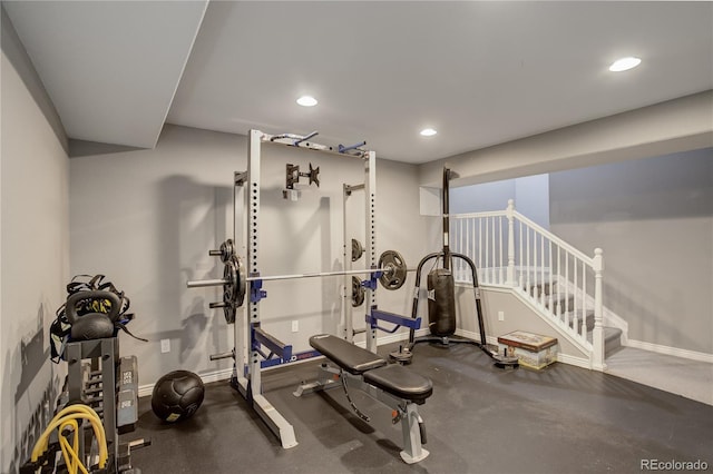 exercise room with baseboards and recessed lighting