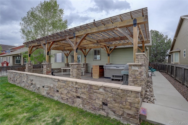 view of patio / terrace featuring a fenced backyard, outdoor dry bar, and a pergola