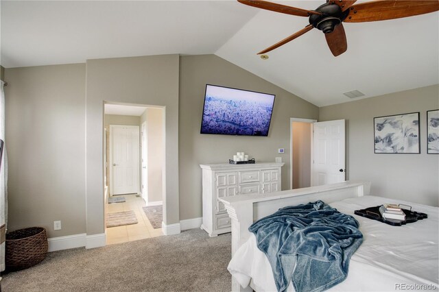 bedroom with baseboards, light carpet, vaulted ceiling, and visible vents