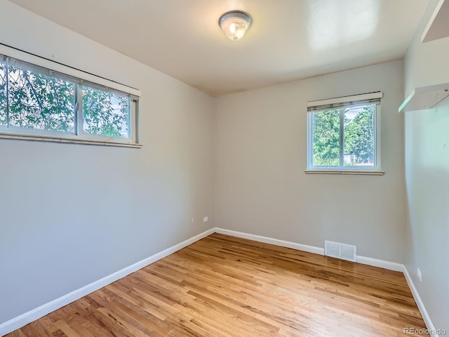 1856 S Steele St, Denver, CO 80210 - unfurnished room featuring light wood-style floors