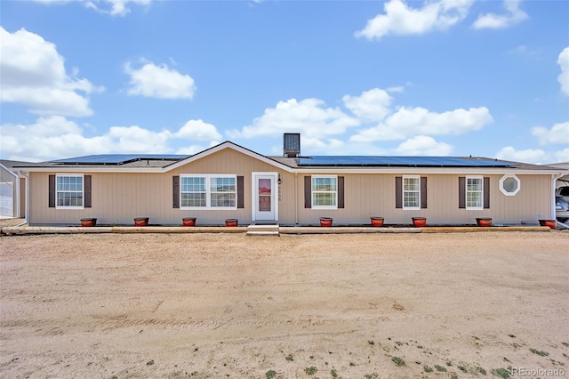 5856 John Ross Ct, Peyton, CO 80831 - view of front of property with solar panels and central AC unit