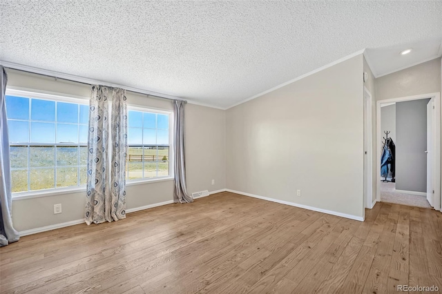 5856 John Ross Ct, Peyton, CO 80831 - spare room with a textured ceiling, wood finished floors, crown molding, baseboards, and recessed lighting