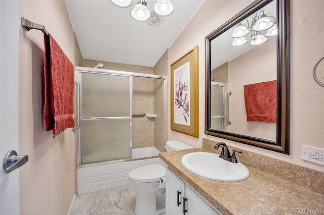 5856 John Ross Ct, Peyton, CO 80831 - bathroom featuring vanity, marble finish flooring, toilet, bath / shower combo with glass door, and a textured ceiling