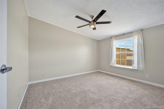 5856 John Ross Ct, Peyton, CO 80831 - empty room featuring a textured ceiling, a ceiling fan, carpet floors, and baseboards