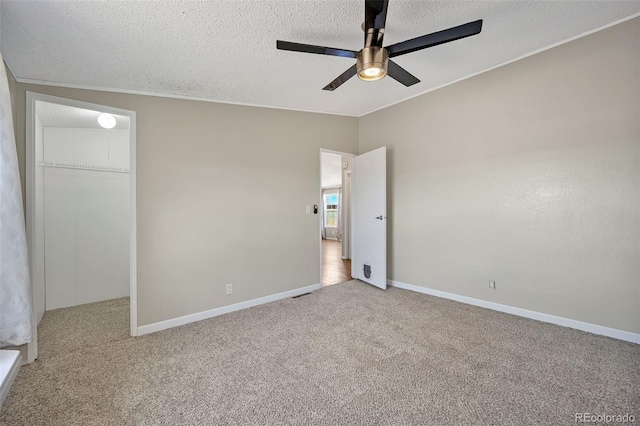 5856 John Ross Ct, Peyton, CO 80831 - unfurnished bedroom with carpet, a textured ceiling, baseboards, ceiling fan, and a closet