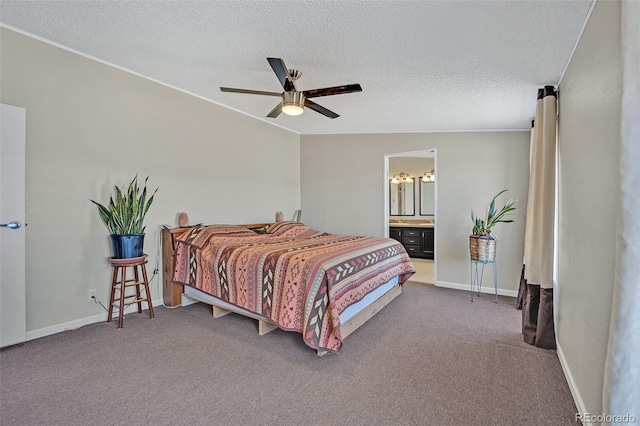 5856 John Ross Ct, Peyton, CO 80831 - carpeted bedroom with a textured ceiling, ensuite bathroom, baseboards, ceiling fan, and ornamental molding