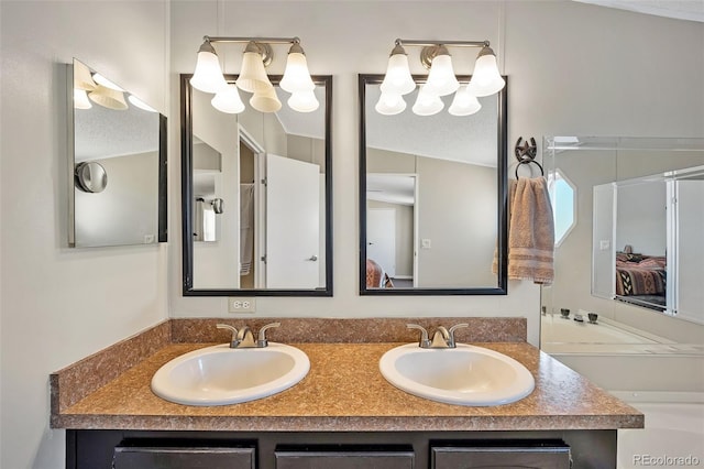 5856 John Ross Ct, Peyton, CO 80831 - ensuite bathroom with double vanity and a textured ceiling