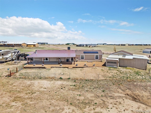 5856 John Ross Ct, Peyton, CO 80831 - rear view of house with an outbuilding