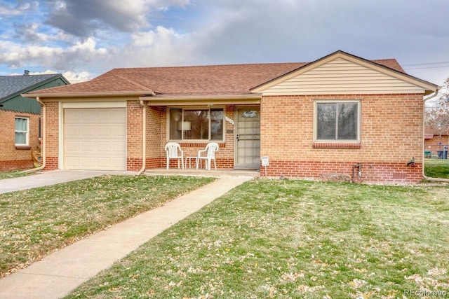 view of front of home with a front yard, a porch, and a garage