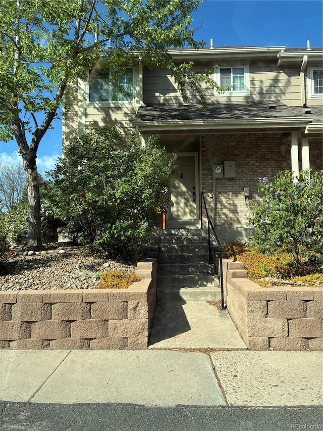 view of front of property featuring brick siding