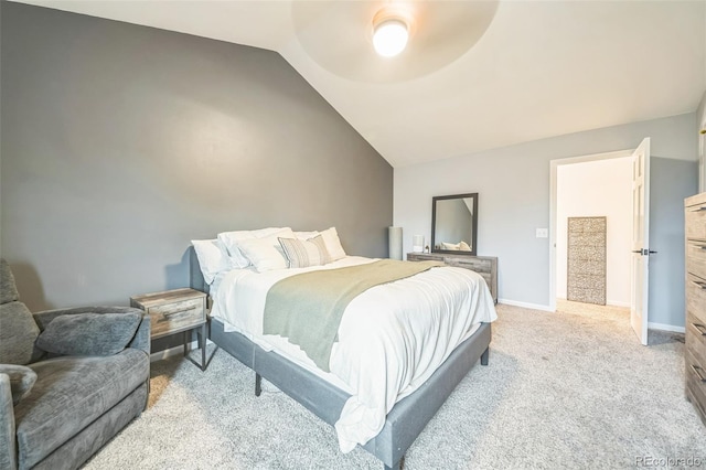 bedroom featuring vaulted ceiling, carpet floors, a ceiling fan, and baseboards