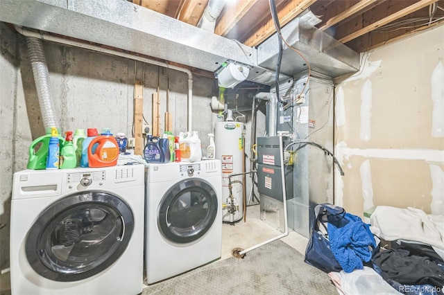clothes washing area with gas water heater, independent washer and dryer, and heating unit