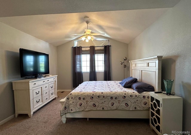 bedroom featuring dark carpet, baseboards, lofted ceiling, and a ceiling fan