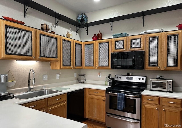 kitchen featuring sink and black appliances