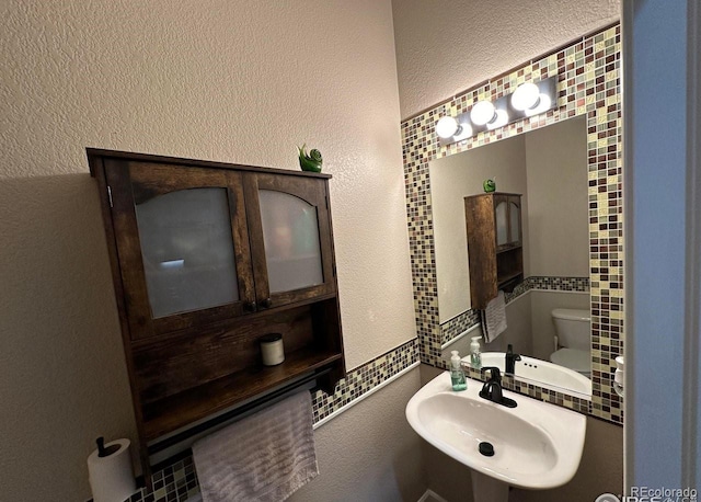 bathroom with toilet and sink