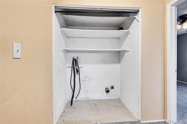 washroom with hookup for an electric dryer and light colored carpet