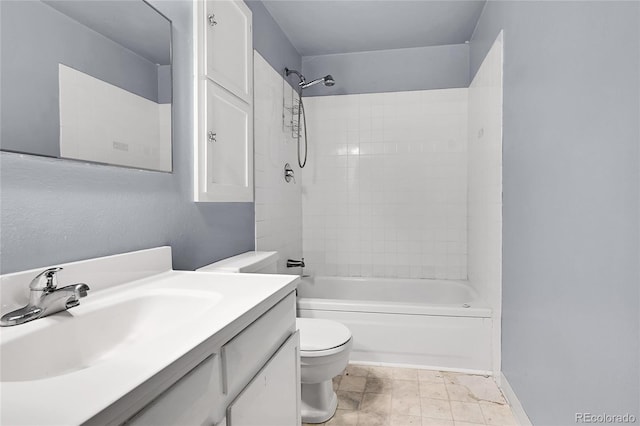 full bathroom with vanity, toilet, and tiled shower / bath