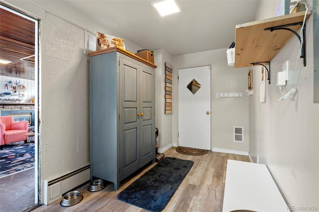 7400 W Quincy Ave, Littleton, CO 80123 - entryway featuring wood finished floors and baseboards