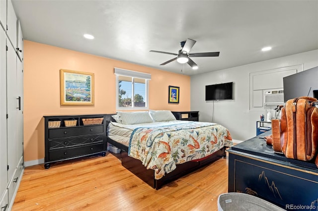 7400 W Quincy Ave, Littleton, CO 80123 - bedroom with light wood-type flooring, recessed lighting, a wall mounted air conditioner, and ceiling fan