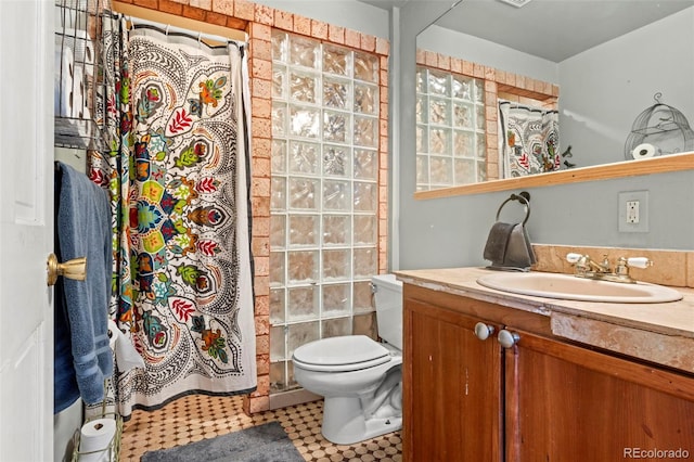 7400 W Quincy Ave, Littleton, CO 80123 - bathroom with vanity, a shower with shower curtain, and tile patterned floors