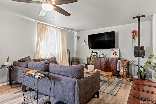 7400 W Quincy Ave, Littleton, CO 80123 - living area with light wood-style floors and a ceiling fan