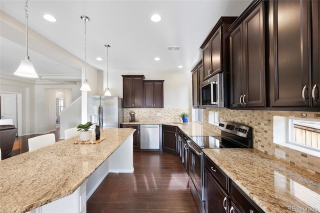 4875 S Catawba St, Aurora, CO 80016 - kitchen featuring stainless steel appliances, dark brown cabinets, dark wood-type flooring, light stone counters, and recessed lighting