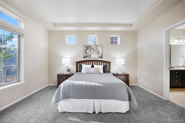 4875 S Catawba St, Aurora, CO 80016 - bedroom featuring carpet flooring, a tray ceiling, and ensuite bathroom