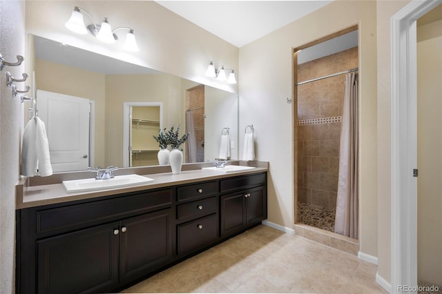 4875 S Catawba St, Aurora, CO 80016 - full bath featuring tiled shower, double vanity, and tile patterned floors