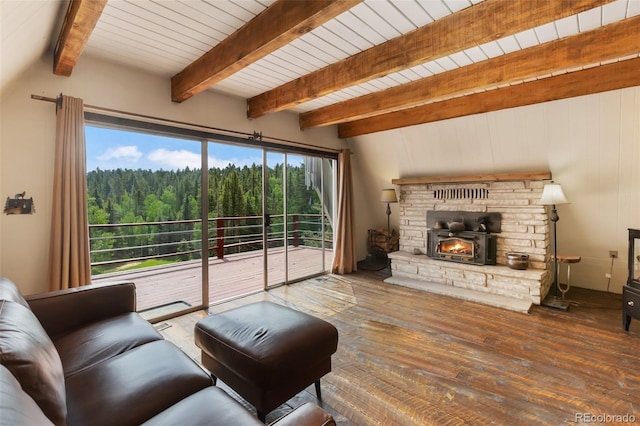 413 W Lake Dr, Divide, CO 80814 - living area with a wooded view, hardwood / wood-style flooring, a fireplace, and beamed ceiling