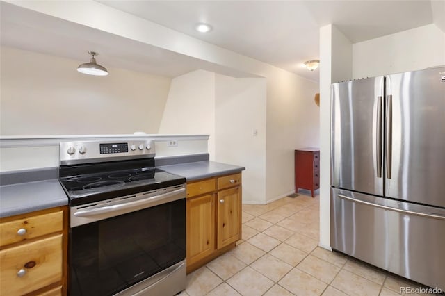 413 W Lake Dr, Divide, CO 80814 - kitchen featuring stainless steel appliances, dark countertops, and light tile patterned floors