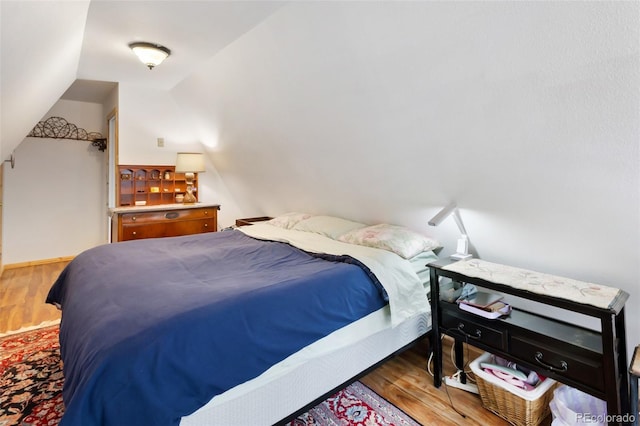 413 W Lake Dr, Divide, CO 80814 - bedroom with wood finished floors and vaulted ceiling