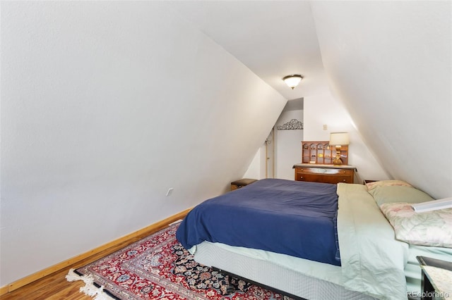 413 W Lake Dr, Divide, CO 80814 - bedroom with wood finished floors and lofted ceiling