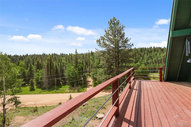 413 W Lake Dr, Divide, CO 80814 - wooden deck with a wooded view