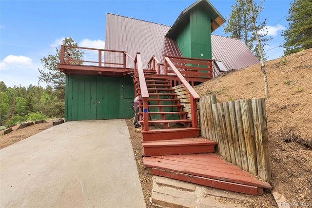 413 W Lake Dr, Divide, CO 80814 - view of front of home featuring stairway, a metal roof, and a deck