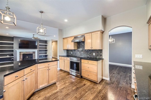 kitchen with light brown cabinets, electric range, dark hardwood / wood-style floors, pendant lighting, and wall chimney range hood