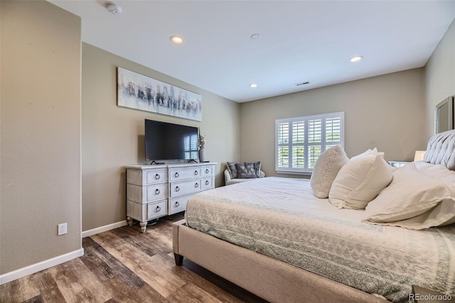 bedroom featuring dark hardwood / wood-style floors