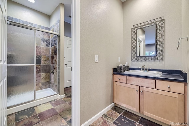 bathroom featuring vanity and walk in shower