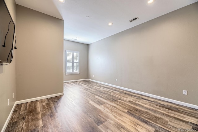 empty room featuring wood-type flooring