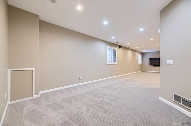 basement with light colored carpet