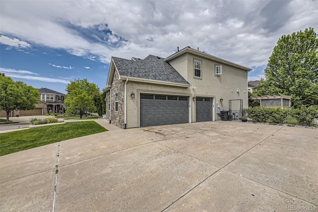 view of side of property with a yard