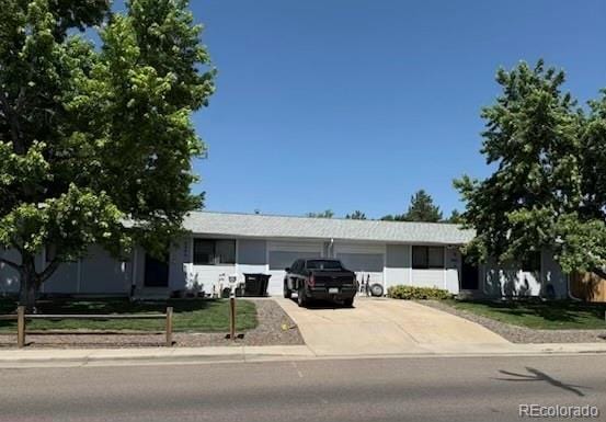 8090 Chase Dr, Arvada, CO 80003 - ranch-style house with a garage and concrete driveway