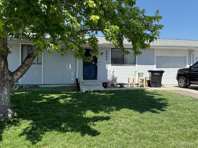 8090 Chase Dr, Arvada, CO 80003 - ranch-style home with a garage, a front yard, and driveway