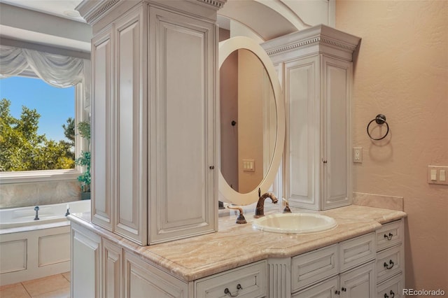 1975 Fox Mountain Pt, Colorado Springs, CO 80906 - full bath featuring a textured wall, a garden tub, tile patterned flooring, and vanity