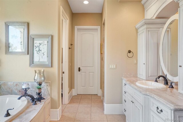 1975 Fox Mountain Pt, Colorado Springs, CO 80906 - bathroom with baseboards, a bath, tile patterned flooring, and vanity