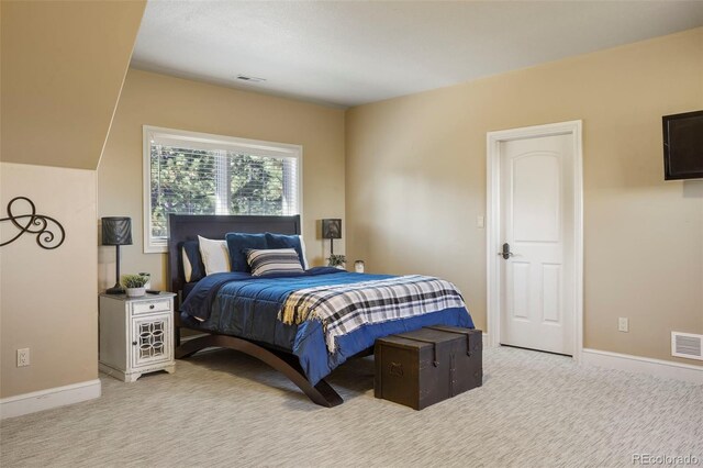 1975 Fox Mountain Pt, Colorado Springs, CO 80906 - bedroom with baseboards, light colored carpet, and visible vents